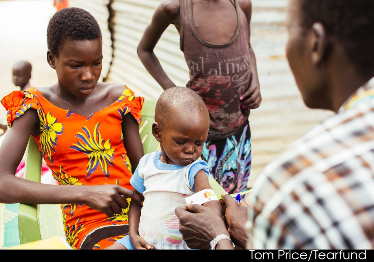 a two-year-old child is assessed for malnutrition at a Tearfund feeding station in Twic East, South Sudan