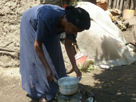 Tsige preparing a meal