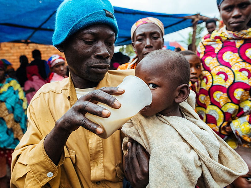 Man feeds baby