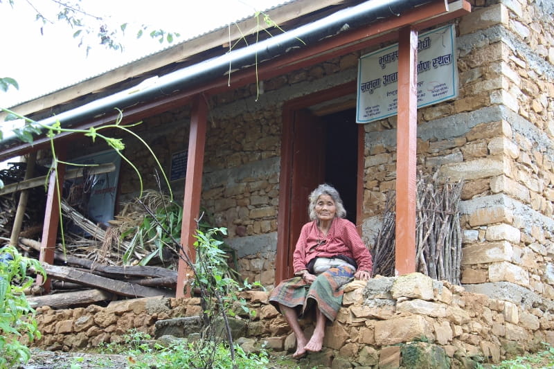 Lady standing outside a home