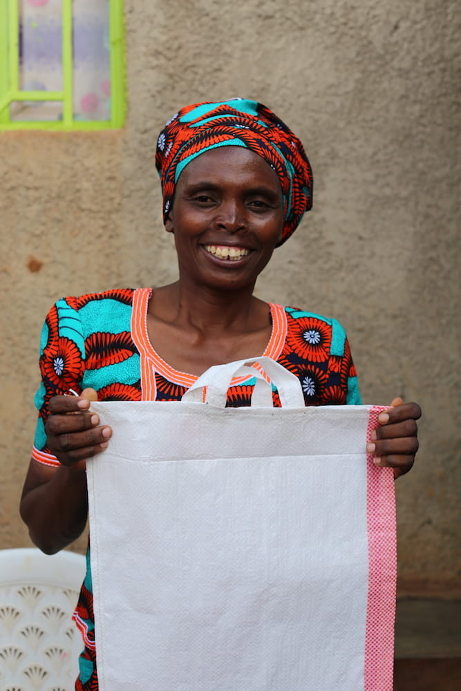 Marie holding bag (credit: Aaron Koch/Tearfund)