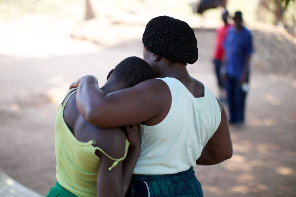 Two African women embracing