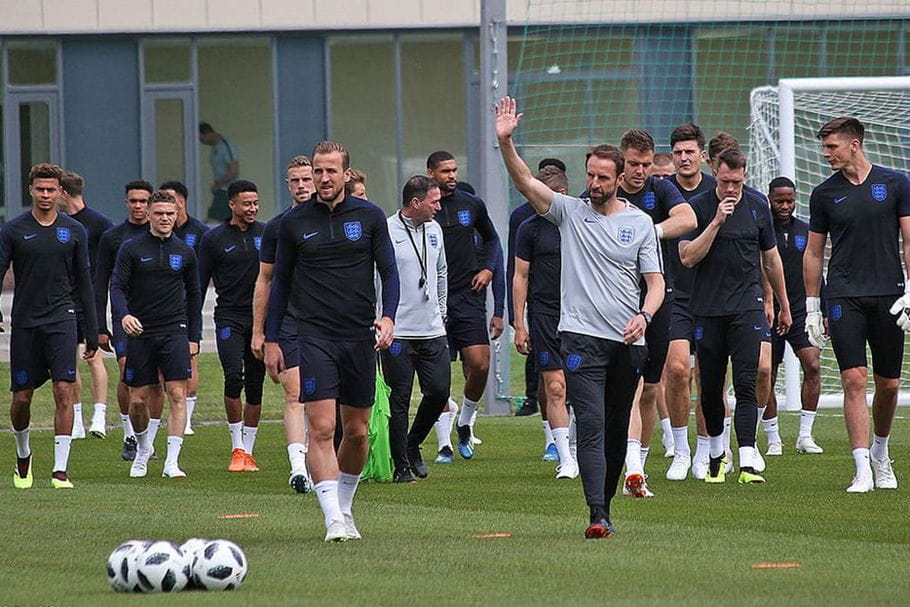 The England football squad walk on the pitch with Gareth Southgate