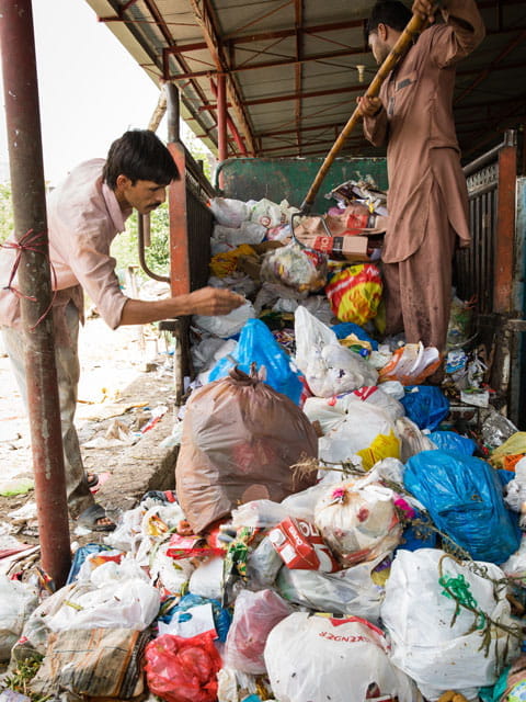 Man tends a waste management site.