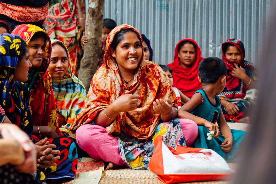 Bangladeshi women sat on ground