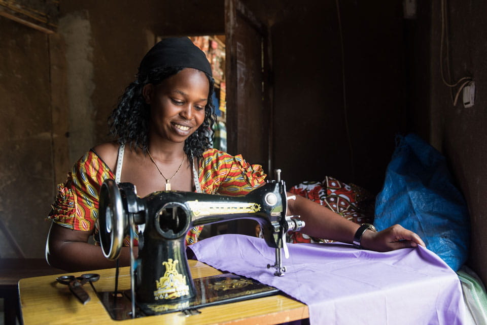 Birungi at sewing machine