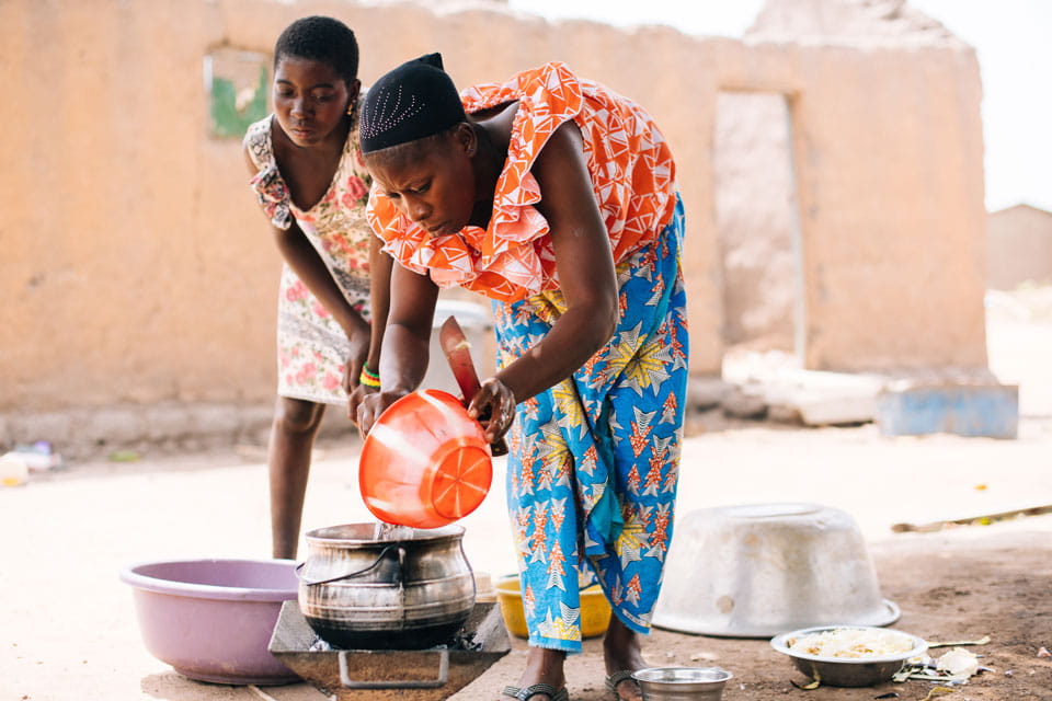 Sita washing plates with daughter