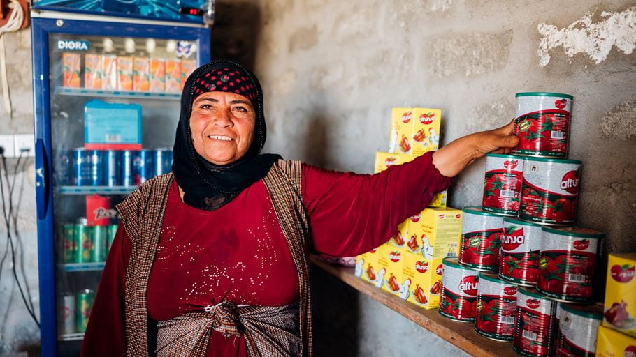 Fatima stands inside the shop she owns in Iraq. Credit: Ruth Towell/Tearfund