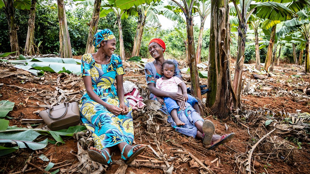 Two women from the Zivu community chat in their banana plantation in southern Rwanda | Credit: Marcus Perkins/Tearfund