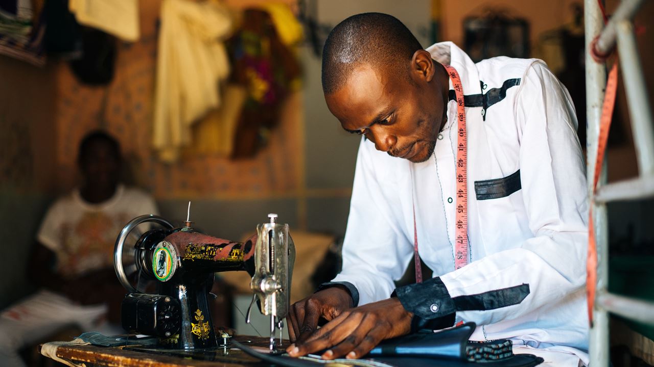 A man working at a sewing machine