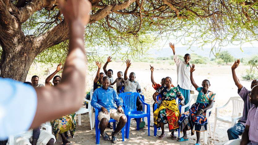 Image of people raising their hands