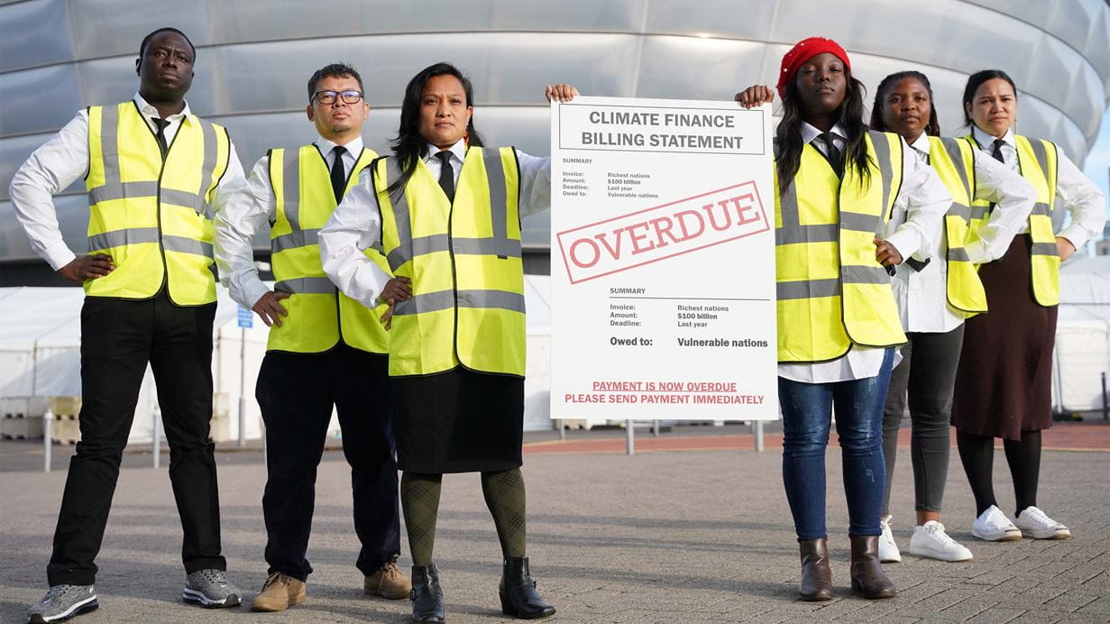 Overdue Bill stunt at COP26 (Jack Wakefield/Tearfund)