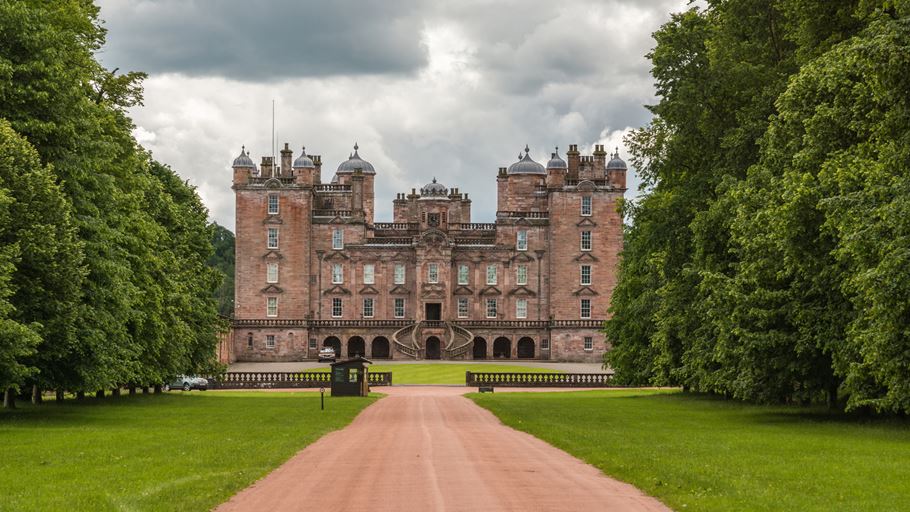 A castle surrounded by trees and grass