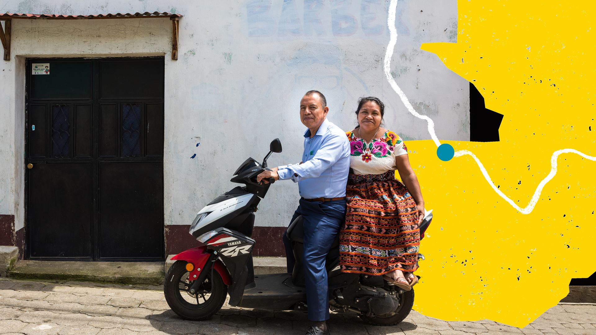 A man and a woman on a scooter