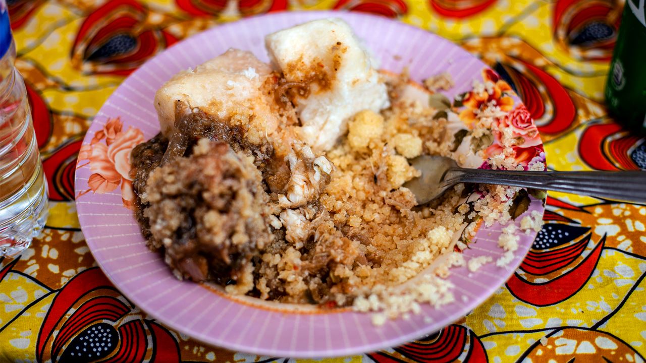 A bowl containing a cake like food