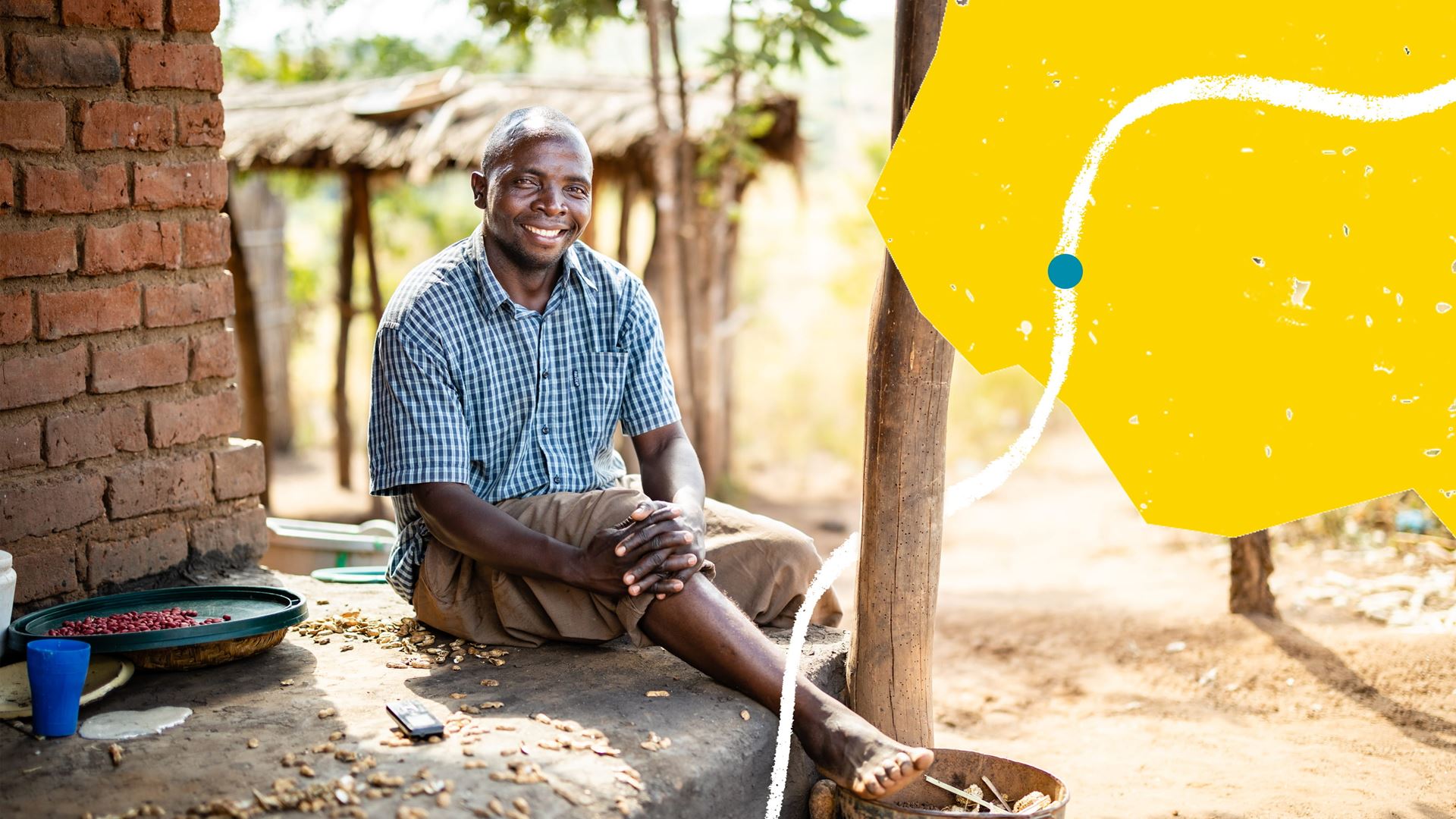 Photo of Banda sitting outside his house in Salima, Malawi