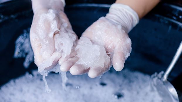 A photo of Sodium lauryl sulphate being added and melted into the liquid