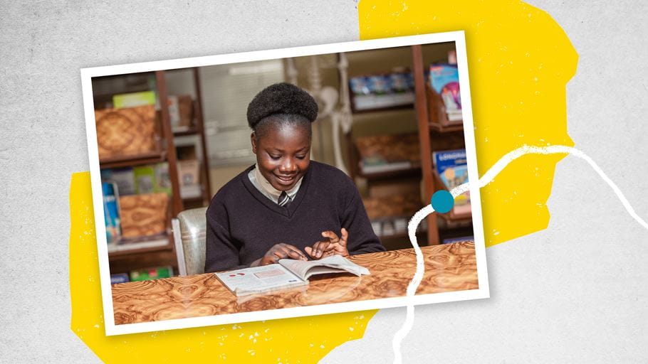 A photo of a student dressed in uniform, sat at a table reading through a book is overlayed on a graphic silhouette of Zambia.