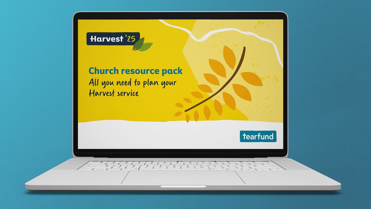 A laptop displays a graphic with the title 'Church resource pack' on the screen.