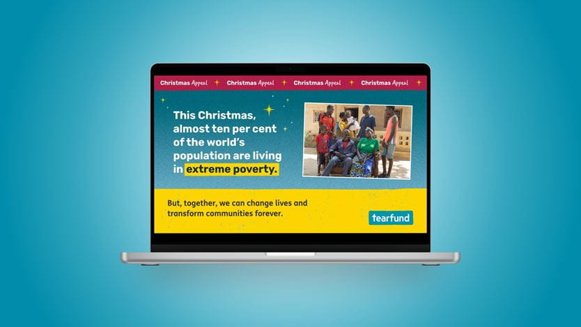 Laptop displaying a Tearfund Christmas Appeal page about extreme poverty.