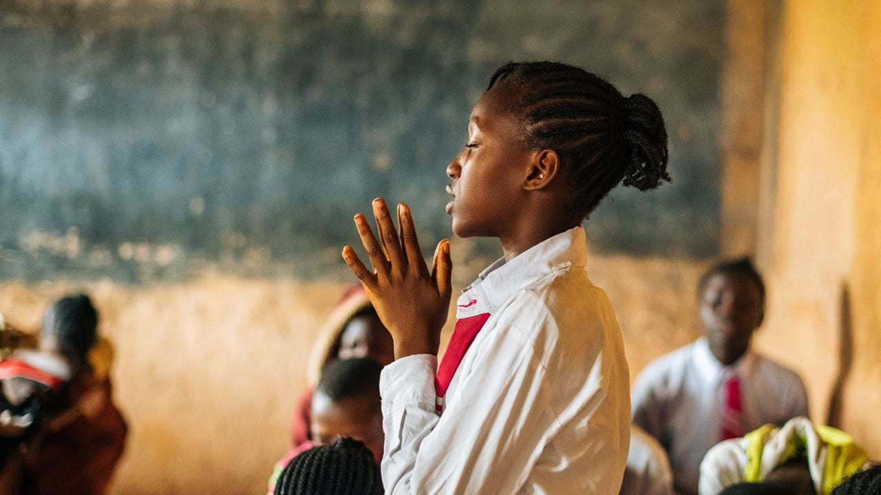 Photo by Tom Price, of a person praying in Nigeria.