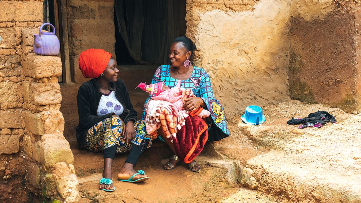 Dorcas spends time talking to Grace, one of the mother’s she’s been supporting,  who had given birth to Gift the day before | Credit: Tom Price/Tearfund