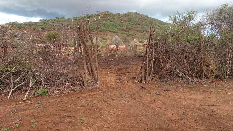 A group of huts in a dry, parched area