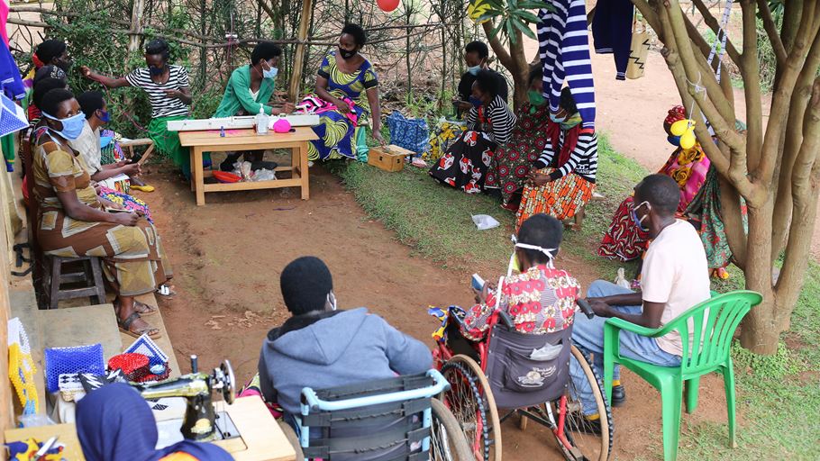 A group of people, including wheelchair users, in a circle