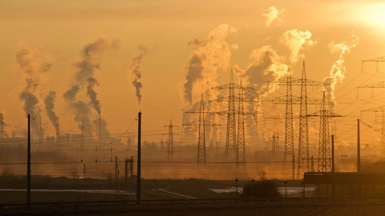 Skyline of industrial chimneys and powerlines