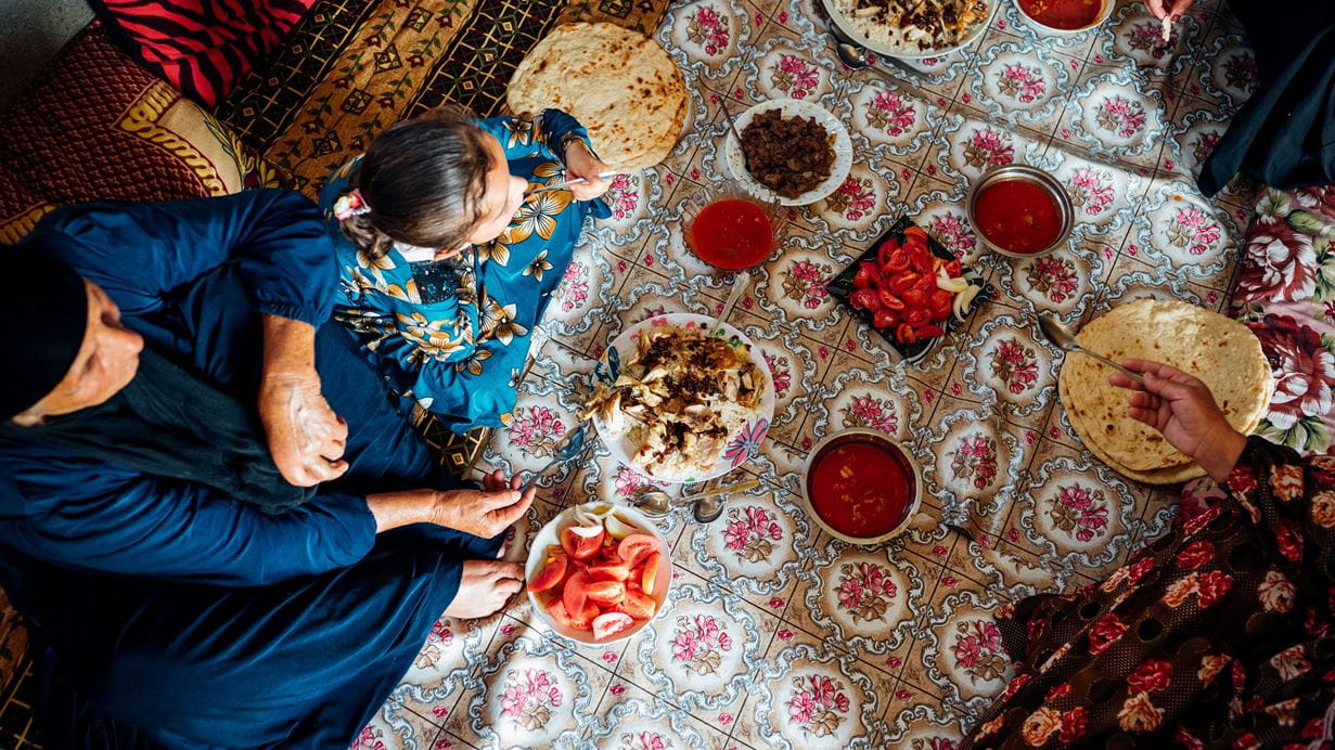 A family in Iraq eating together.