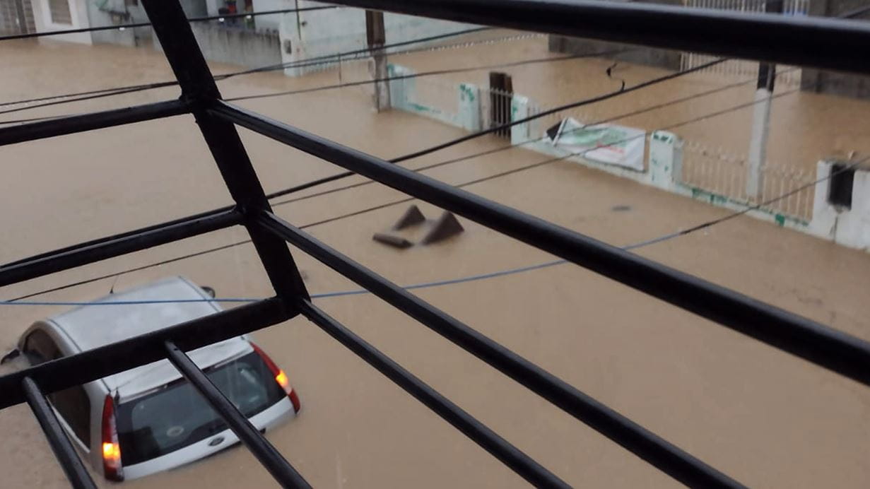 View out of a window overlooking a flooded street