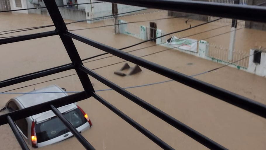 View out of a window overlooking a flooded street