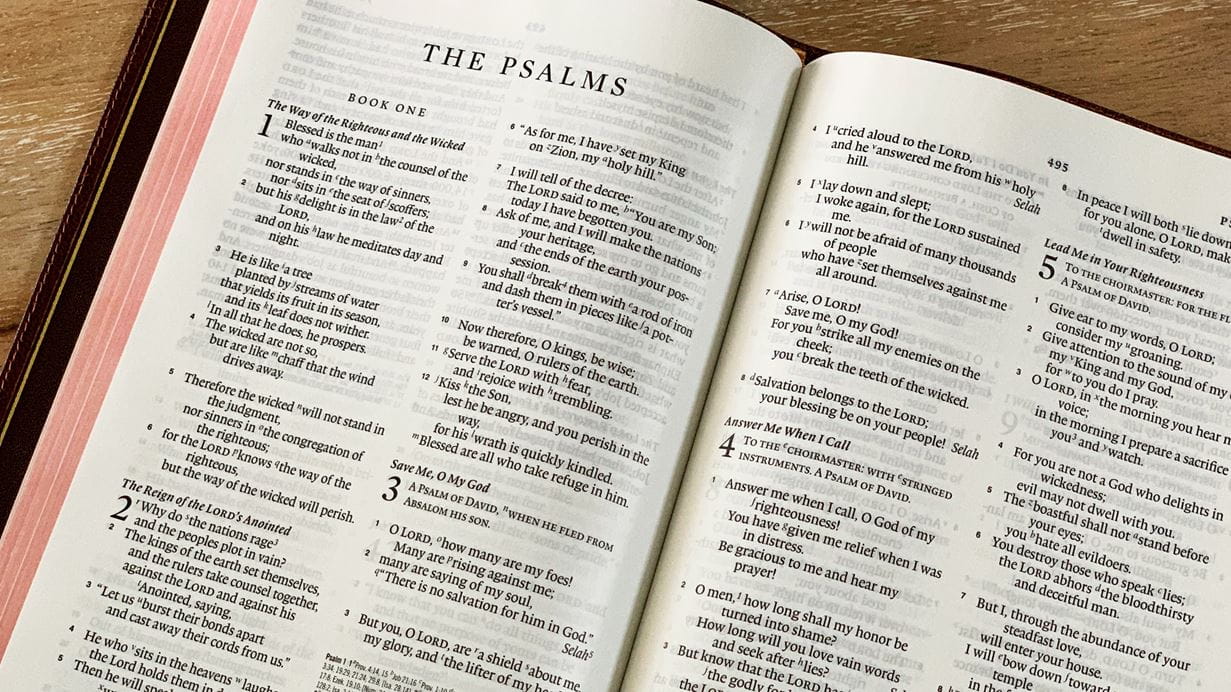 An open Bible displaying the book of Psalms