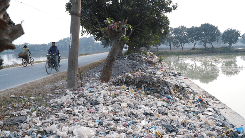 Plastic waste piled by a roadside in Bangladesh