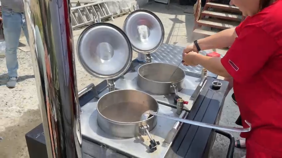 Two large pots are prepared in a field kitchen set up by Tearfund's local church partner in Kherson city after a major dam breach caused massive flooding in southern Ukraine.