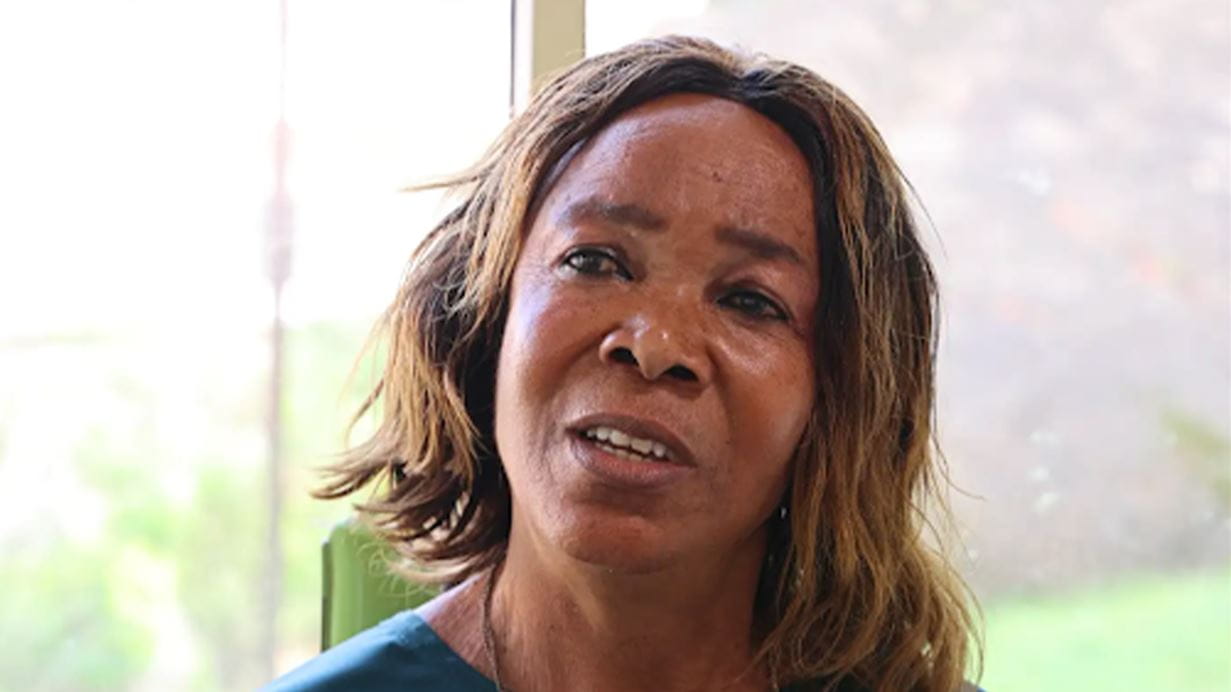 A close up of a woman, Constance, who looks to the side of the camera as she talks.