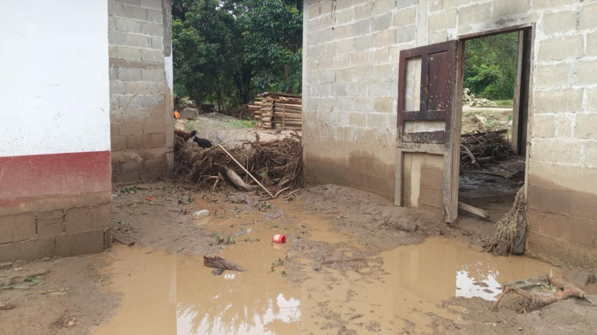 Mud and debris inside and outside homes after the flooding in Northern Thailand