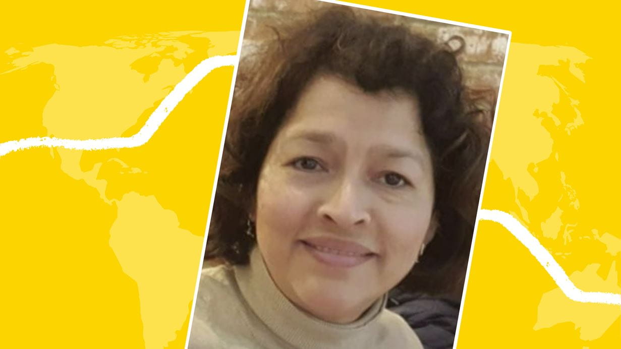 Portrait of a woman with short brown curly hair, against a stylized yellow world map background.