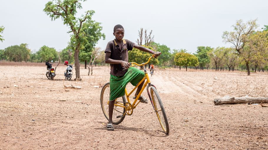 Abigael's son on a bike