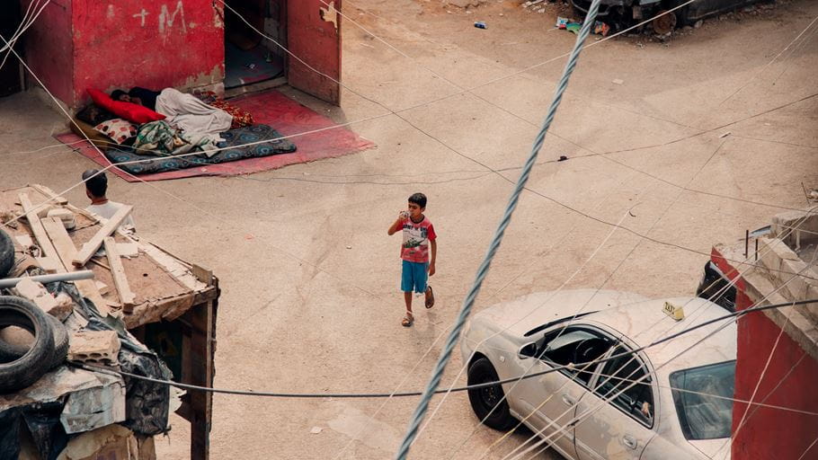 A child walks through an informal refugee settlement in Beirut, Lebanon. Credit: Ruth Towell/Tearfund