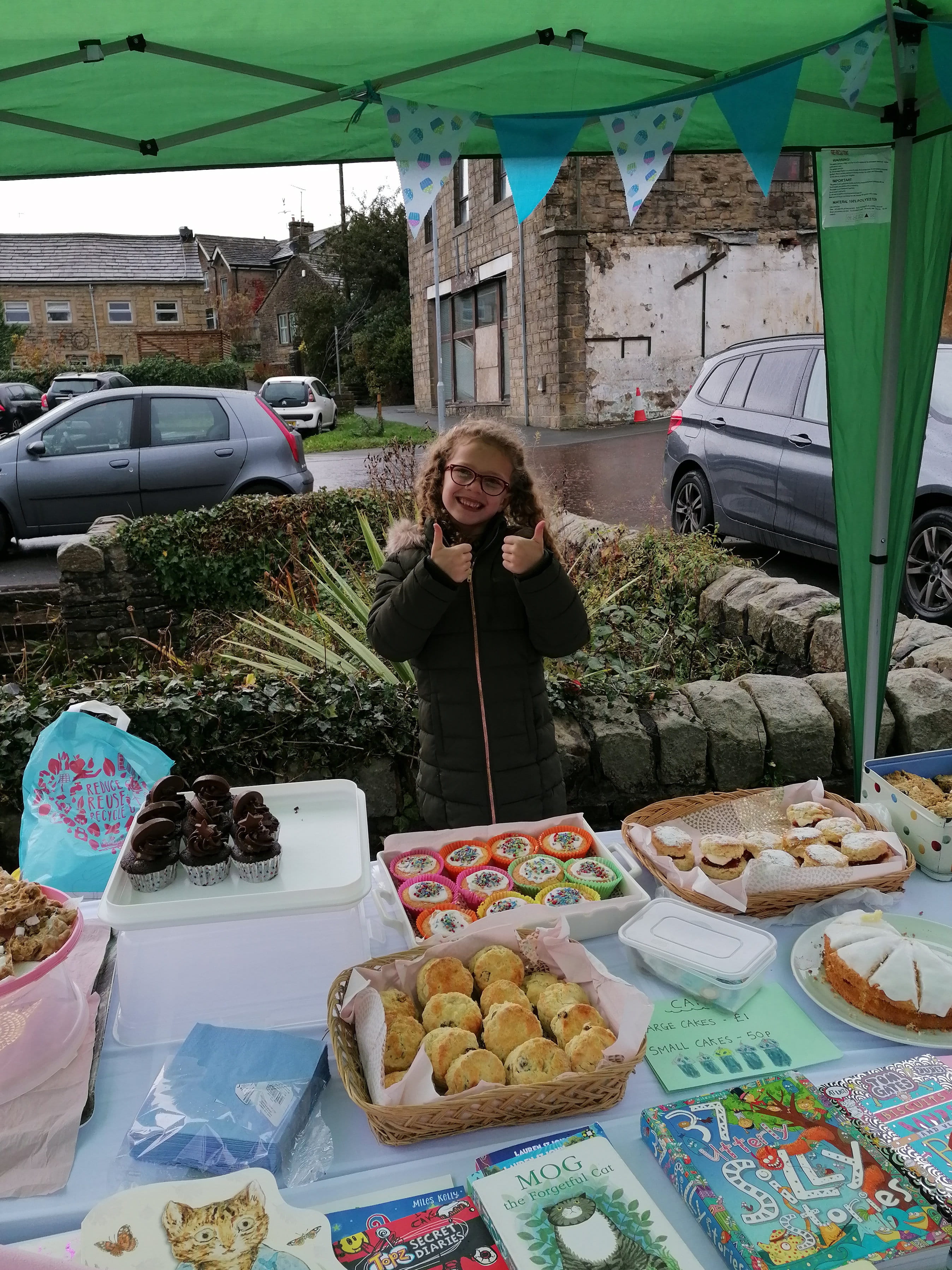 Amelie Whittaker with her splendid array of goods for sale to benefit international development charity Tearfund.