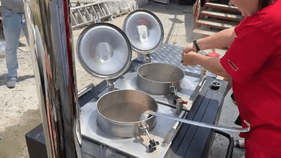 Two large pots are prepared in a field kitchen set up by Tearfund's local church partner in Kherson city after a major dam breach caused massive flooding in southern Ukraine.